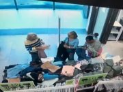 Mother caught on camera attempting to pickpocket while accompanied by her young son