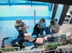 Mother caught on camera attempting to pickpocket while accompanied by her young son